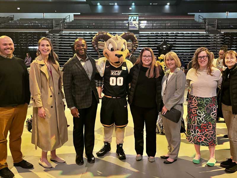 Six VCU School of Pharmacy faculty and staff members join the dean and Rodney the Ram (VCU's mascot) to celebrate their years of service to the university